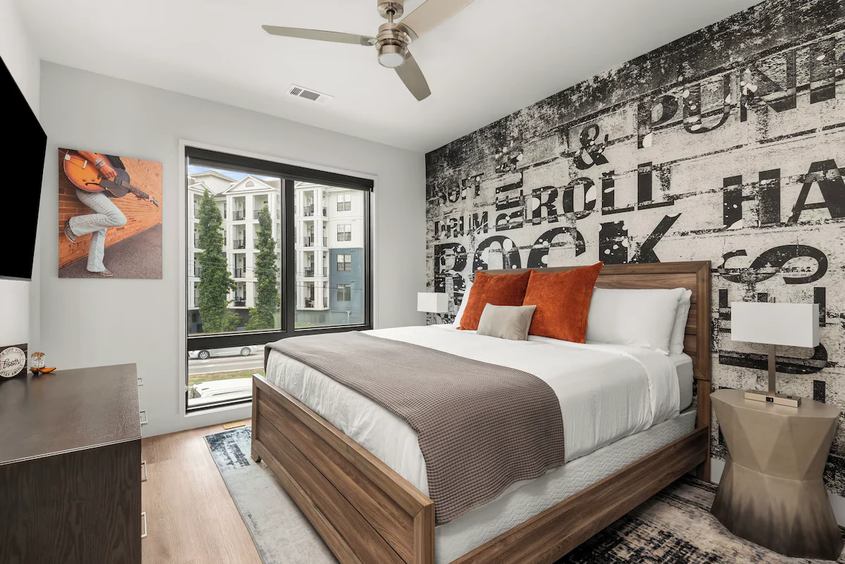 Second bedroom with queen-size bed and modern decor